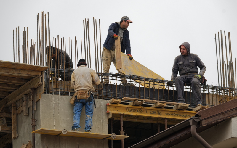 21 - Construction workers operating on a building site in Romania